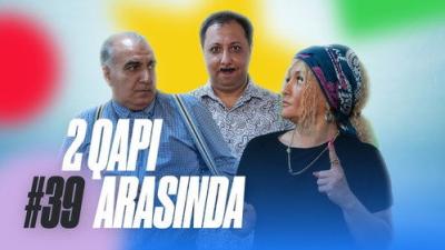 2 Qapı Arasında